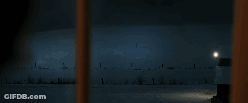 Blurred Person Standing In Dark GIF