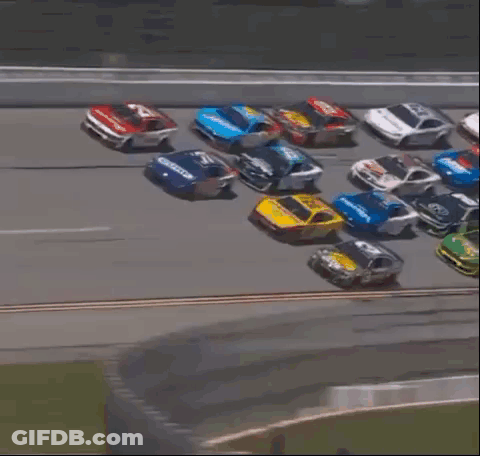 Blurred Race Car Going Down Track GIF
