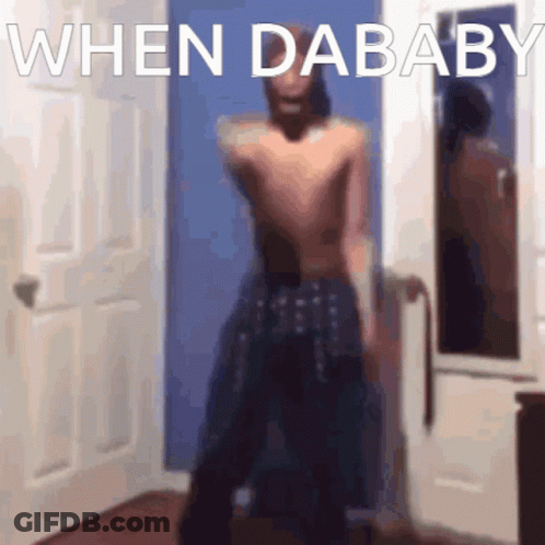 Blurred Shirtless Man Standing In Front Of Door GIF