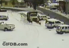 Blurred Snowy Parking Lot With Cars GIF