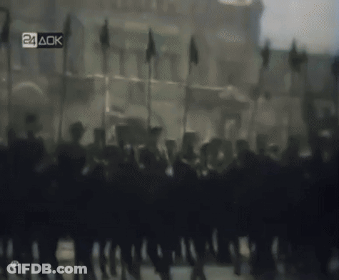 Blurred Soldiers Marching With 24 AOK Sign GIF