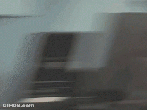 Blurred Train Going Down Staircase GIF