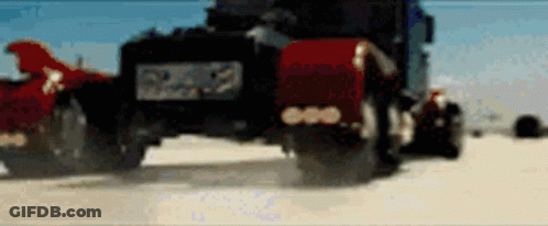 Blurred Truck Driving Down Dirt Road GIF