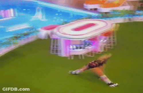 Blurred Woman Lying On Grass By Building Number 0 GIF