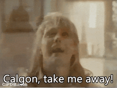 Blurred Woman Saying Calgon Take Me Away GIF