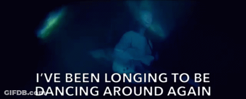 Blurred Woman Saying I've Been Longing To Be Dancing Around Again GIF