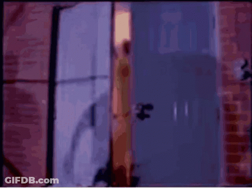 Blurred Woman Standing In Doorway GIF