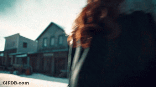 Blurred Woman Walking Down Street GIF