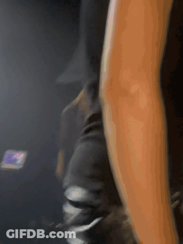 Blurry Arm With Phone In Background GIF