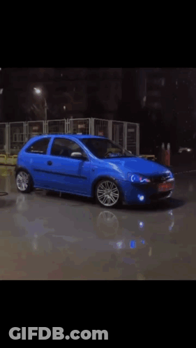 Blurry Blue Toy Car Number 8 GIF