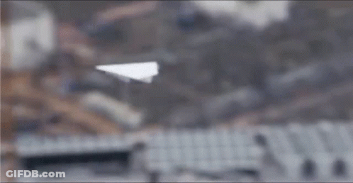 Blurry Building With Ferris Wheel GIF