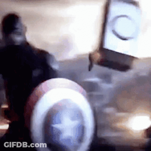 Blurry Captain America Shield With Star In Dark Room GIF