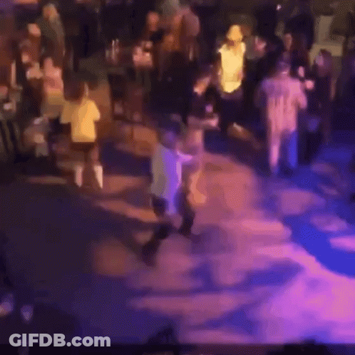 Blurry Crowd Dancing At Party GIF
