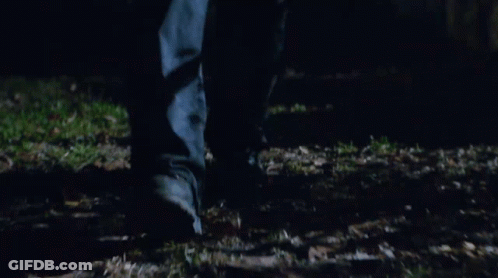 Blurry Feet Walking Through Grass GIF
