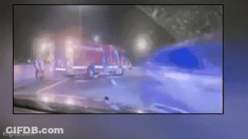 Blurry Fire Truck And Police Car Driving At Night GIF