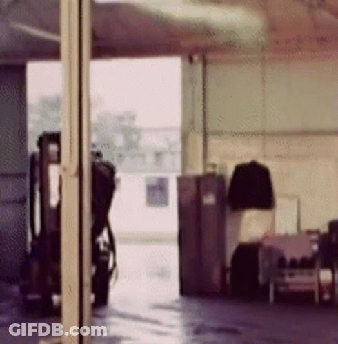 Blurry Garage With Parked Motorcycle GIF