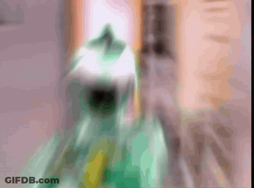 Blurry Green Object With Yellow Stripe GIF