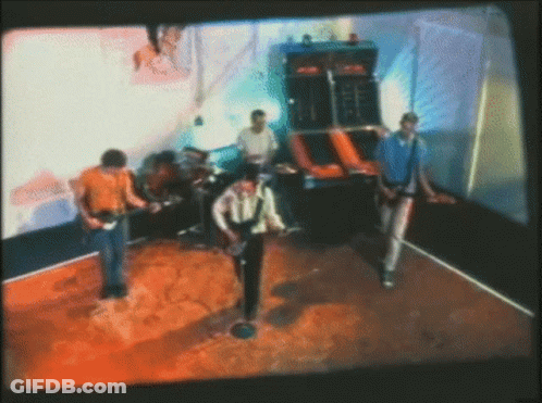 Blurry Group Of Men Playing Guitars GIF