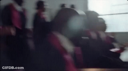 Blurry Group Of People Sitting On A Plane GIF