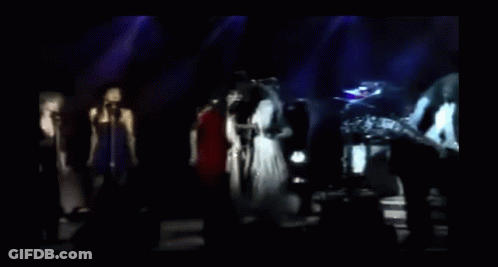 Blurry Group Singing On Stage GIF