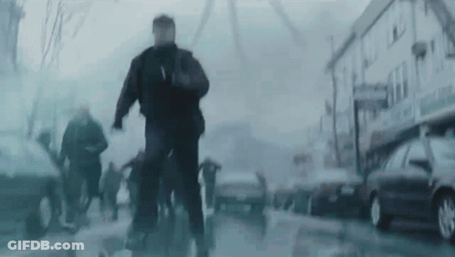 Blurry Group Walking Past Building Saying A GIF