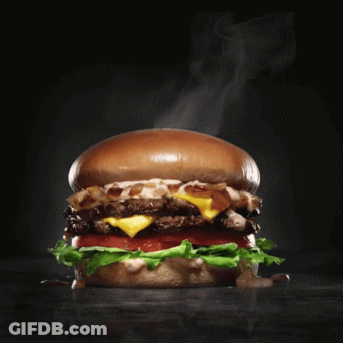 Blurry Hamburger With Cheese Lettuce Tomato And Onions GIF