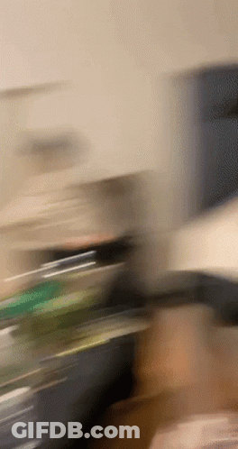 Blurry Hand Holding Bottle GIF