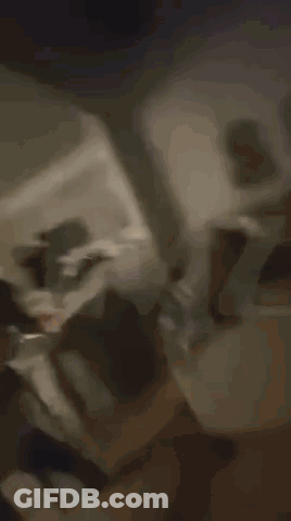 Blurry Living Room With Stairs And Table GIF