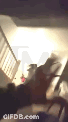 Blurry Living Room With Stairs And Table GIF