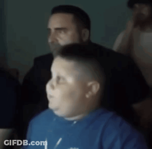 Blurry Man And Boy In Blue Shirt GIF