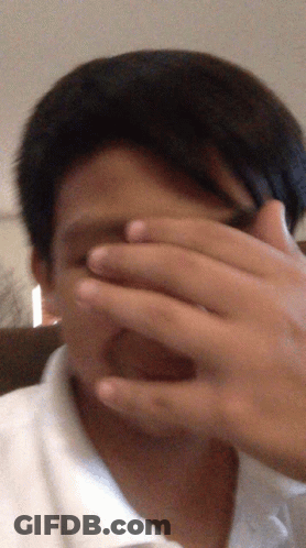 Blurry Man Covering Face GIF
