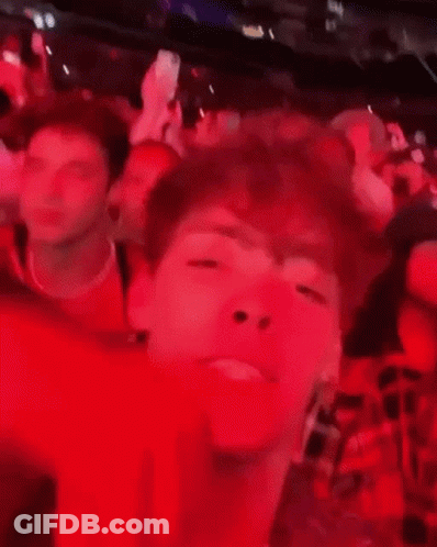 Blurry Man Face In Crowded Room GIF
