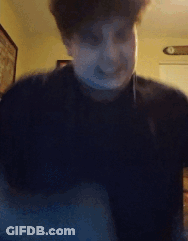 Blurry Man Face With Clock On Wall GIF