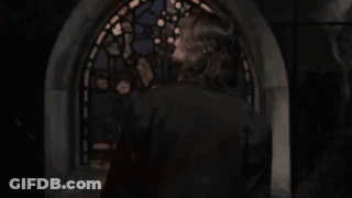 Blurry Man Holding Gun In Front Of Window GIF