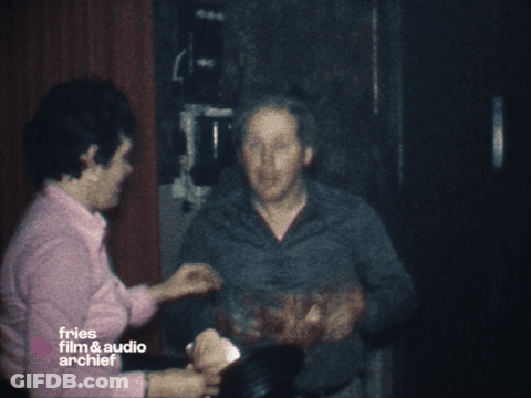 Blurry Man Holding Gun In Front Of Window GIF