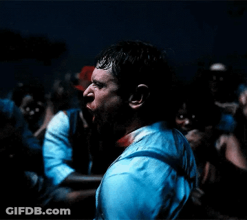 Blurry Man Holding Microphone In Dark Room GIF