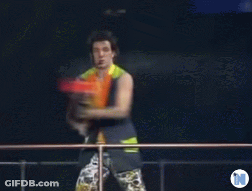 Blurry Man Holding Water Gun With Letter N GIF