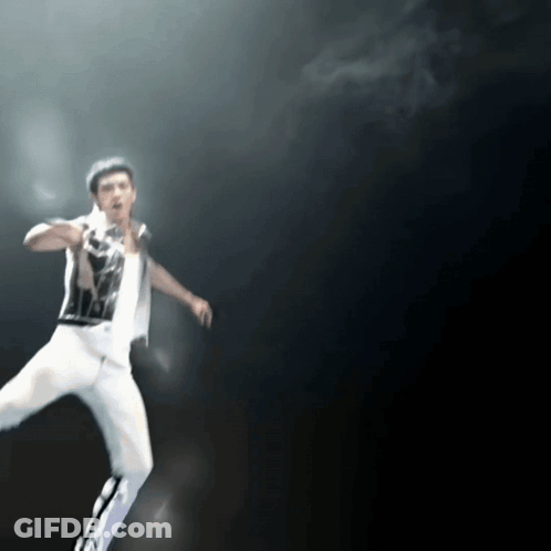 Blurry Man In Black And White Shirt And White Pants GIF