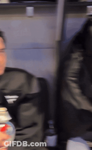 Blurry Man In Black Jacket With Letter F GIF