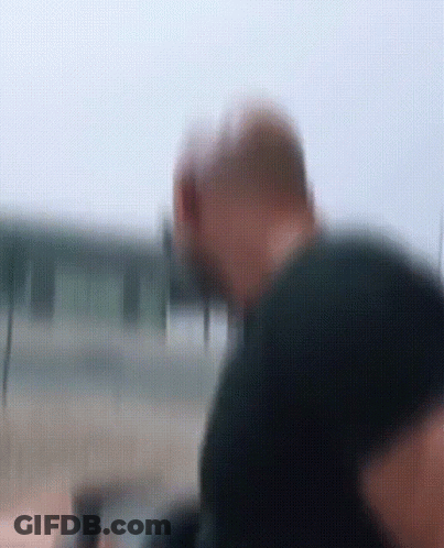 Blurry Man In Black Shirt Looking GIF