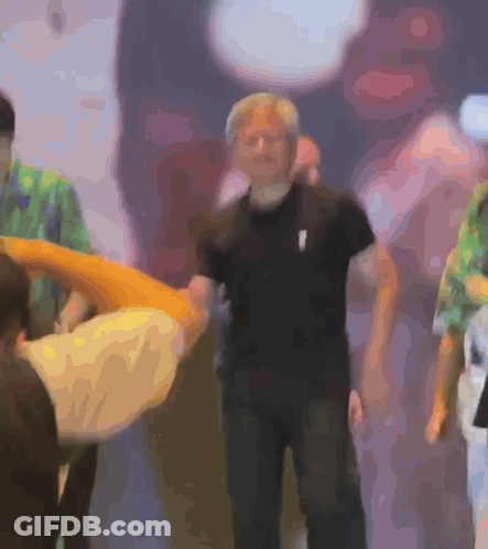 Blurry Man In Black Shirt With White Arrow GIF