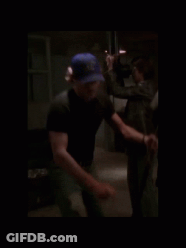 Blurry Man In Blue Hat Saying U.S. Navy GIF
