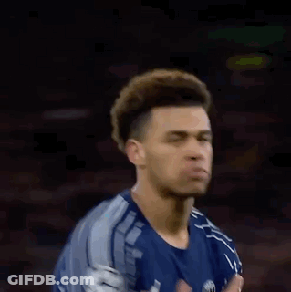 Blurry Man In Blue Shirt Holding Head GIF
