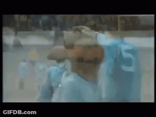 Blurry Man In Blue Shirt With Number 5 GIF