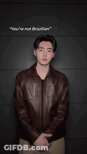 Blurry Man In Brown Jacket With OK GIF