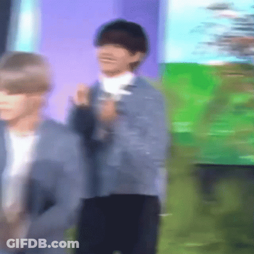 Blurry Man In Front Of Green Field GIF