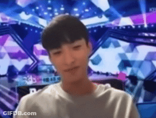 Blurry Man In Front Of Stage With Letter R GIF