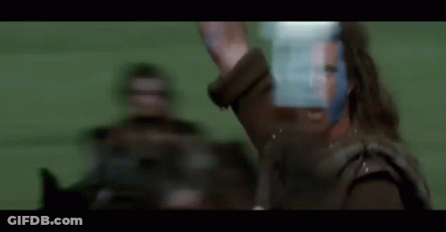 Blurry Man In Leather Jacket Holding Sword GIF