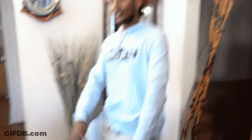 Blurry Man In Light Blue Sweatshirt Saying A GIF