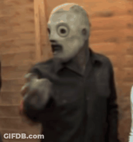 Blurry Man In Mask Pointing GIF